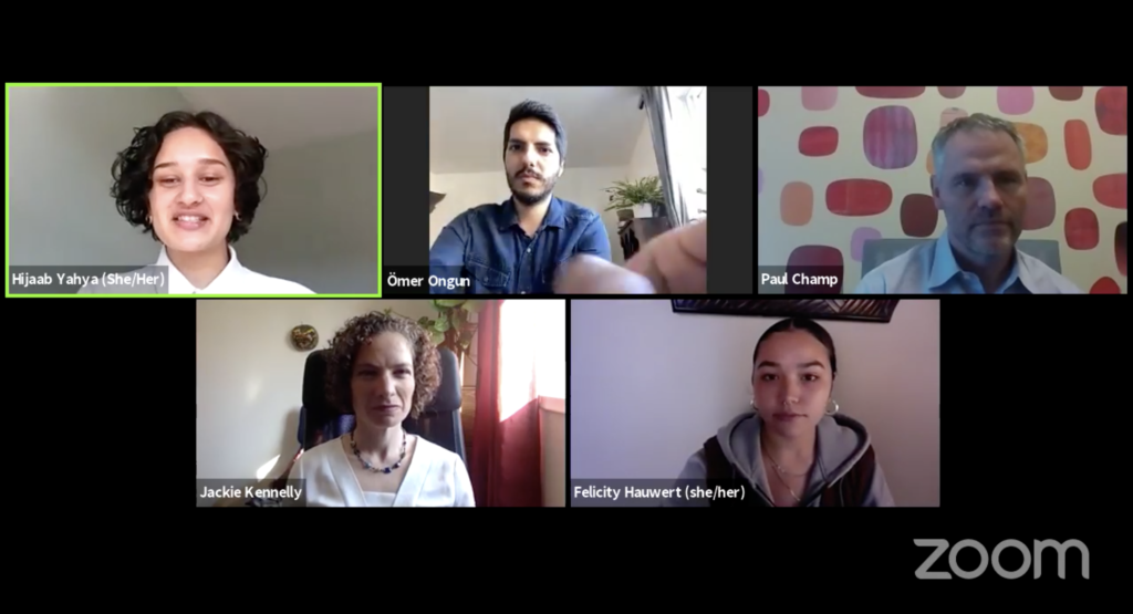 A Zoom meeting screenshot showing Omer Ongun, Jackie Kennelly, Paul Champ, and two student hosts